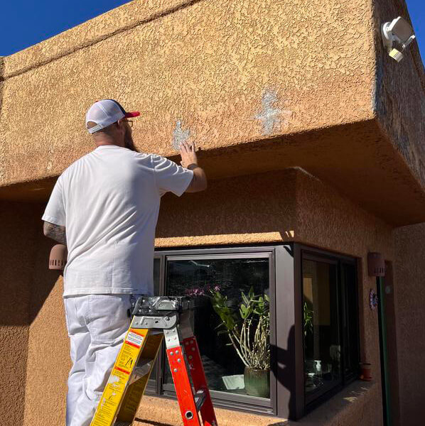 Tucson Painting Company - Piper Family Painting, performing an exterior painting job
