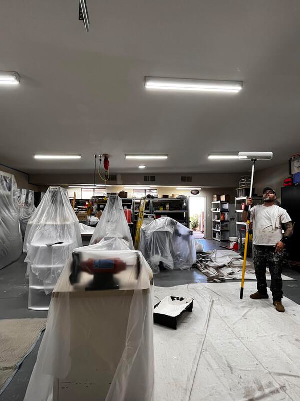 Professional Oro Valley Painting Company setup by Piper Family Painting Company showing a protected workspace and a painter working with precision.