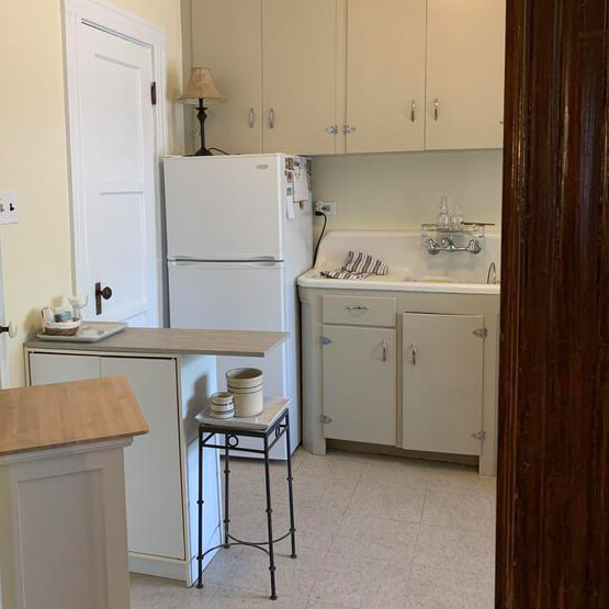 Charming kitchen painted by Piper Family Painting Company, an Oro Valley Painting Company, featuring cream cabinets and warm neutral wall tones.