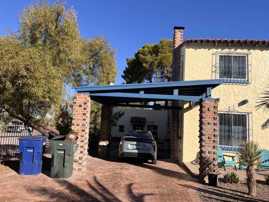 Piper Family Painting Company showcases a Rancho Vistoso Painting Company project with beige stucco, blue trim, and desert landscaping under a clear sky.