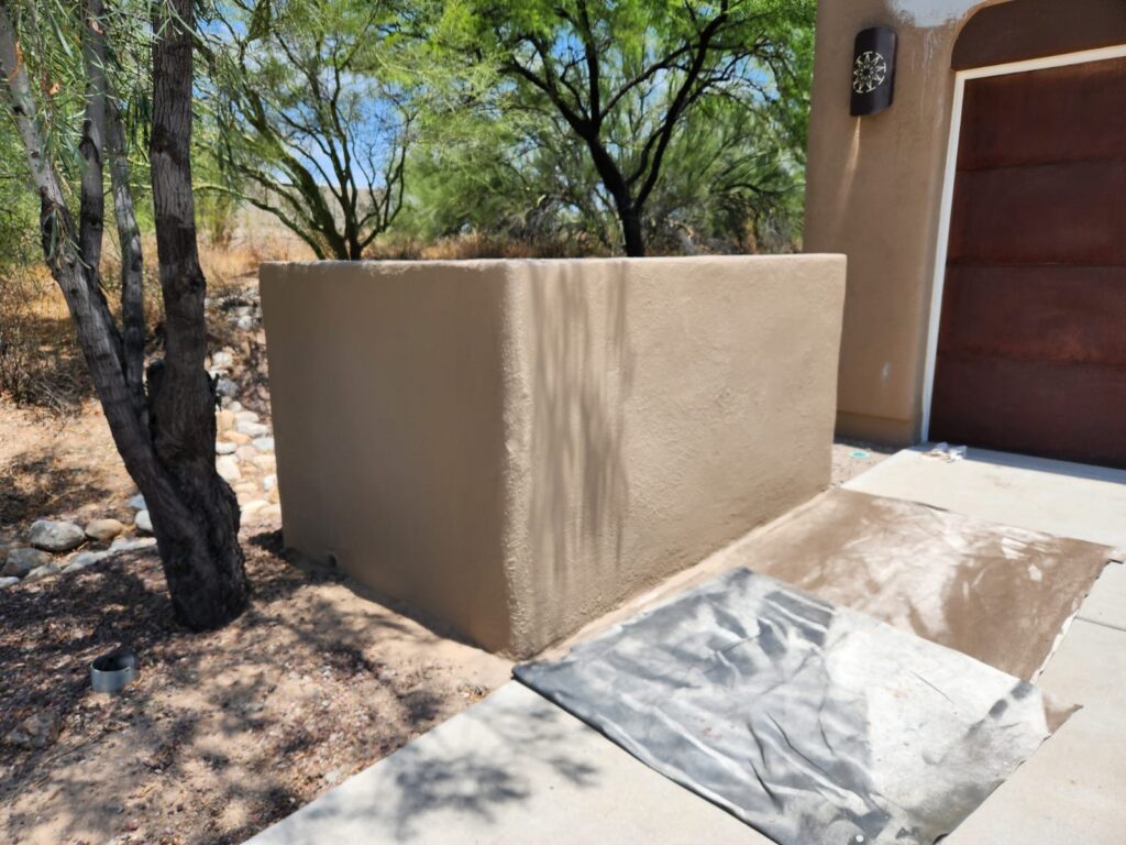 Piper Family Painting Company showcases expert stucco painting in a Rancho Vistoso residential setting with warm tones blending into the desert landscape.